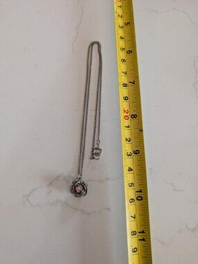 Vintage Silver Toned Rose Pendant Necklace with a pink rhinestone